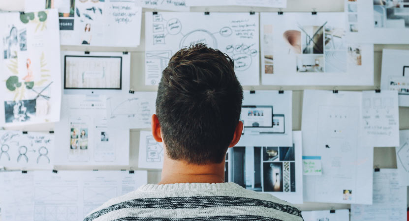 Person Looking at Pin Board